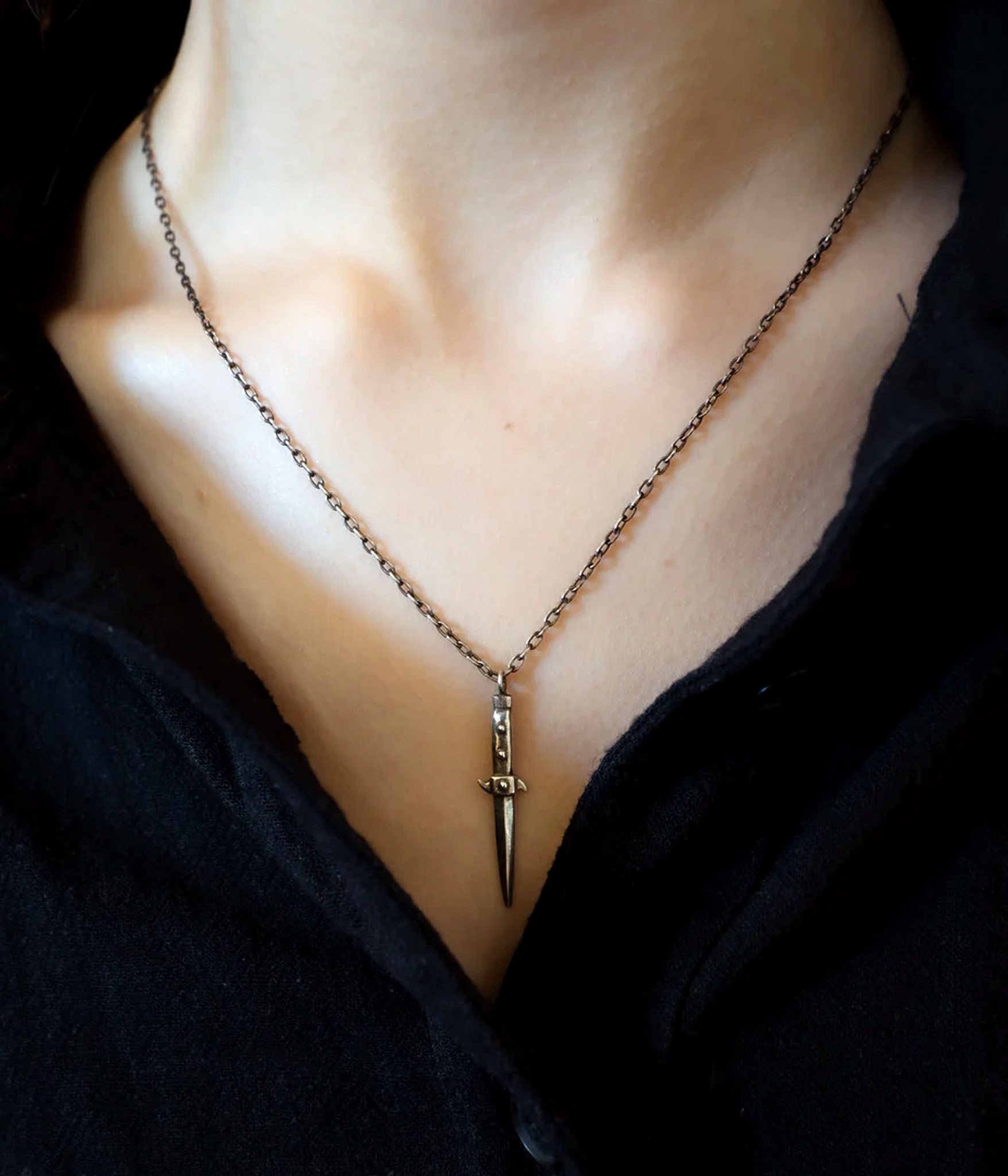 switchblade necklace on model 