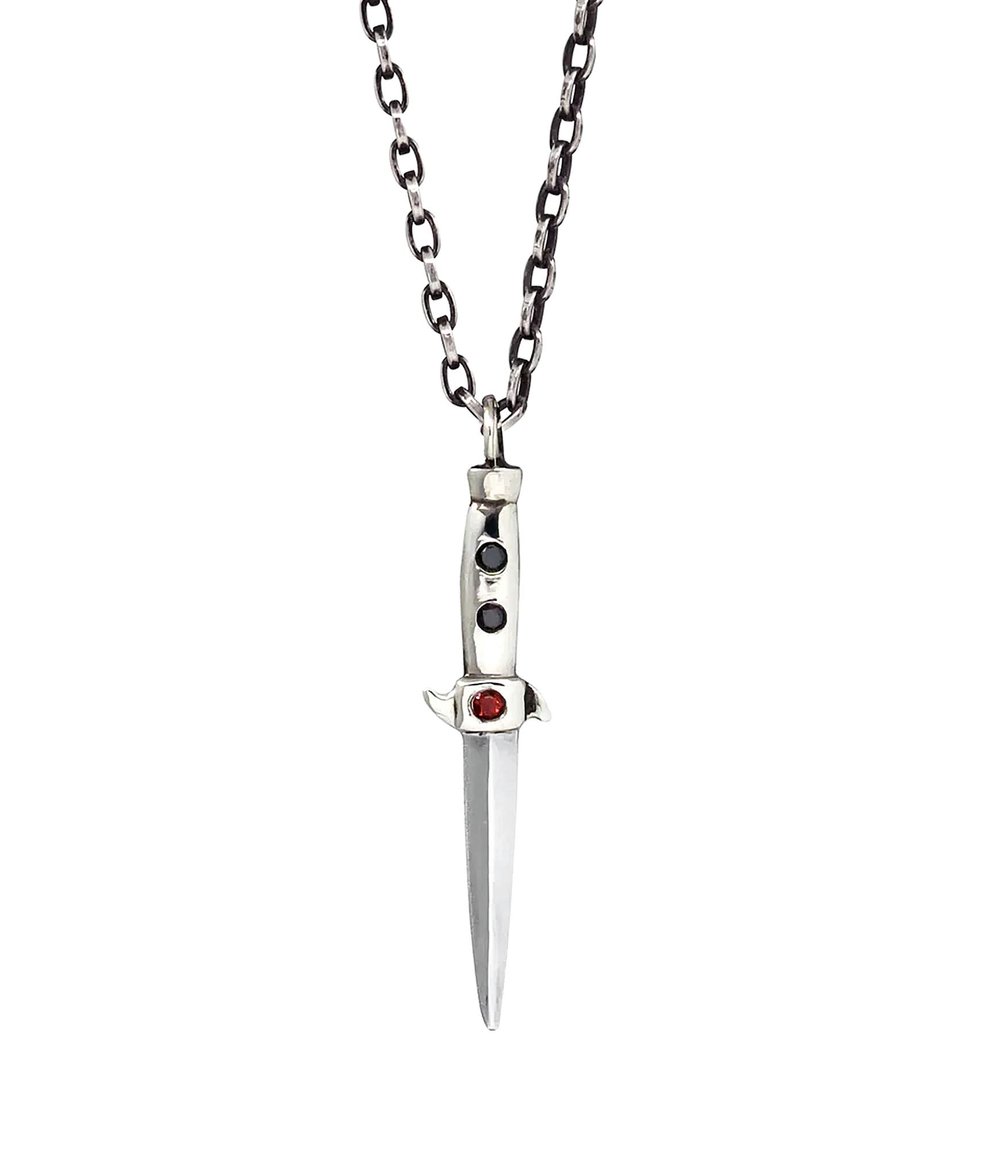 silver switchblade necklace with 2 black diamonds and 1 red garnet. studio shot on white background 