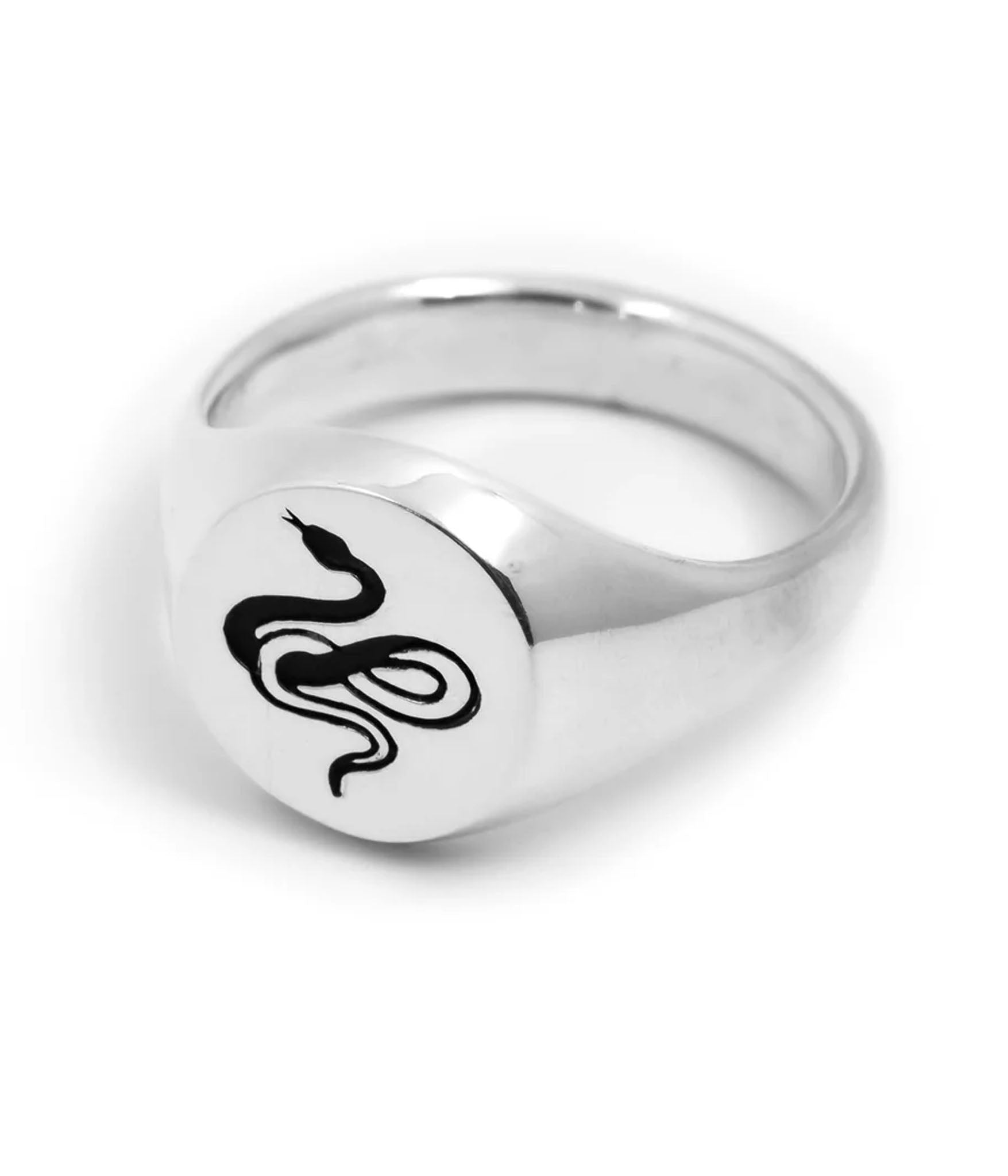 Traditional round sterling silver signet ring with snake engraving by Futaba for The Hunt  shot on white back ground