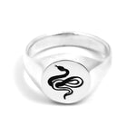 Traditional round sterling silver signet ring with snake engraving by Futaba for The Hunt shot on white background 