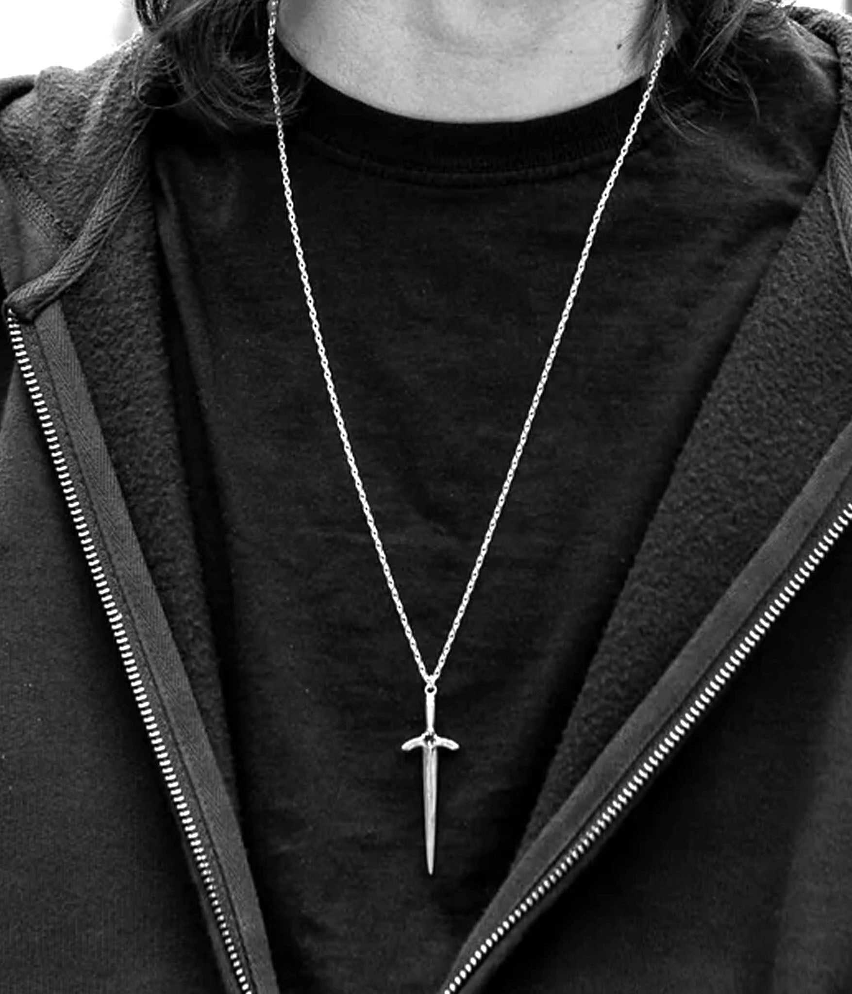 Black and white photo of sword necklace worn on model – sterling silver long blade pendant on silver chain by The Hunt