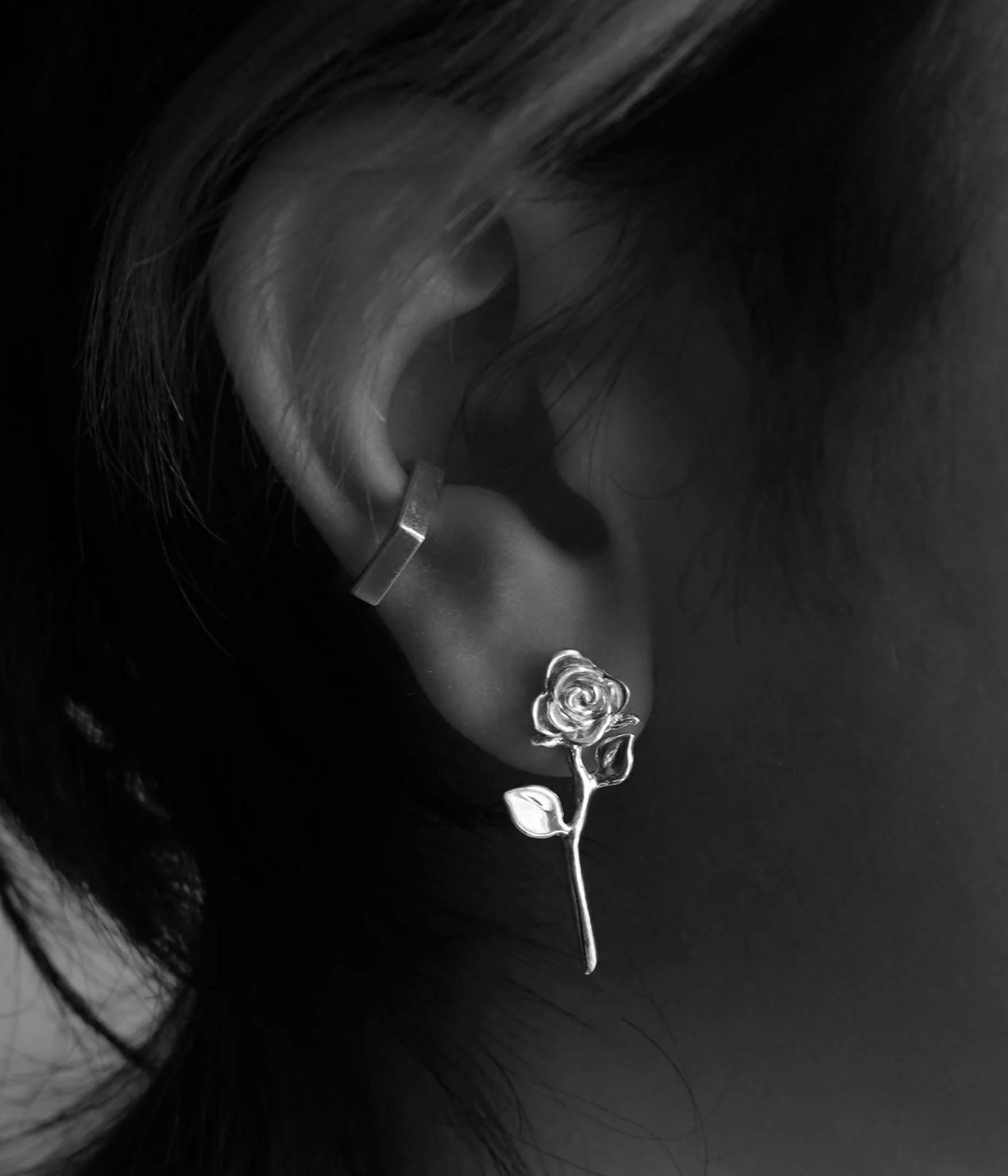 devotion rose earring stud on model in black and white shot
