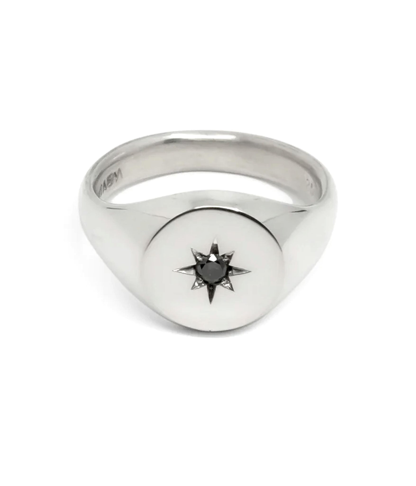 Sterling silver ring with engraved star motif centered on white background — celestial-inspired statement ring