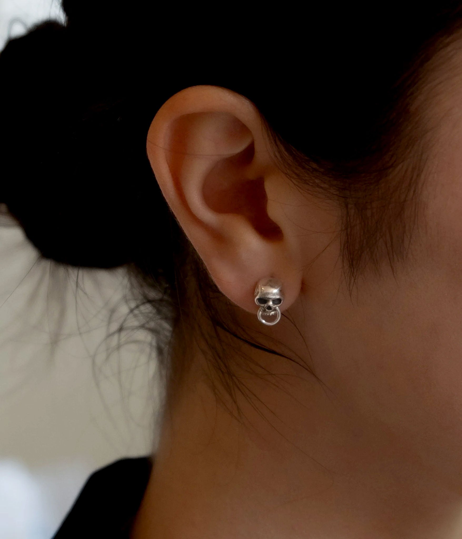 Skull Door Knocker Stud earring in lifestyle shot on ear