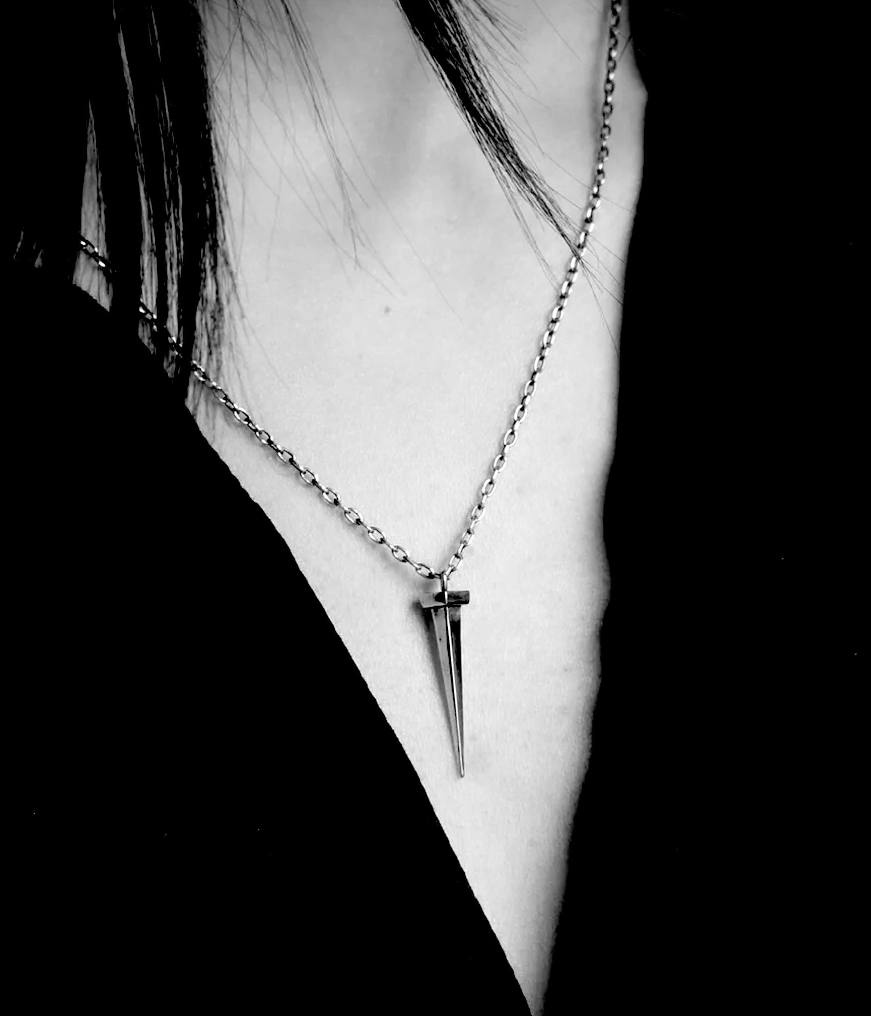 Tough as nails necklace on model hot in black and white 