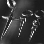 black and white moody shot of tough as nails earring 