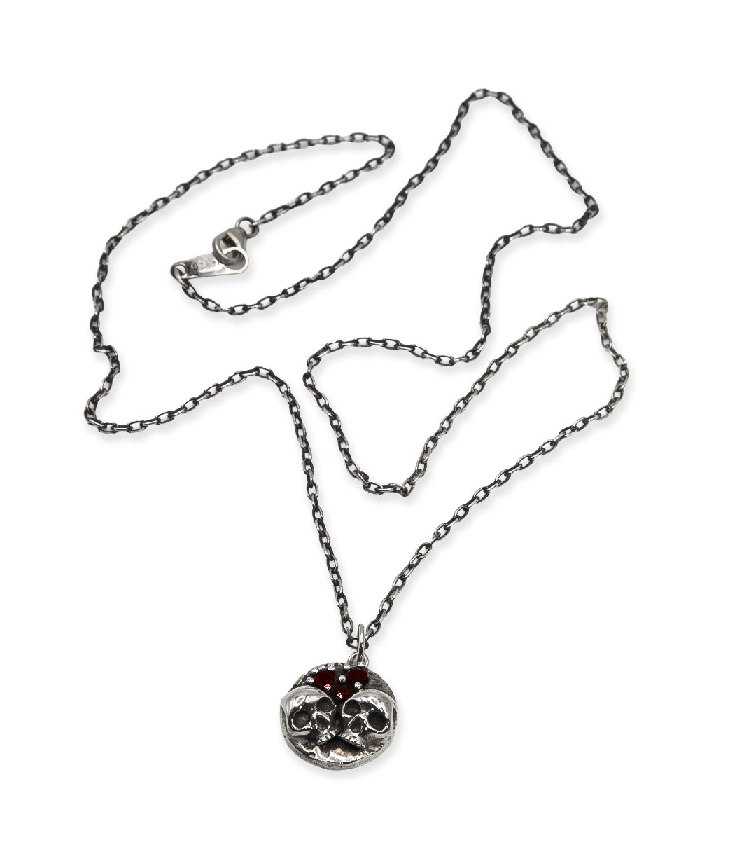 Silver necklace with a pendant on a white background