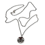 Silver necklace with a pendant on a white background