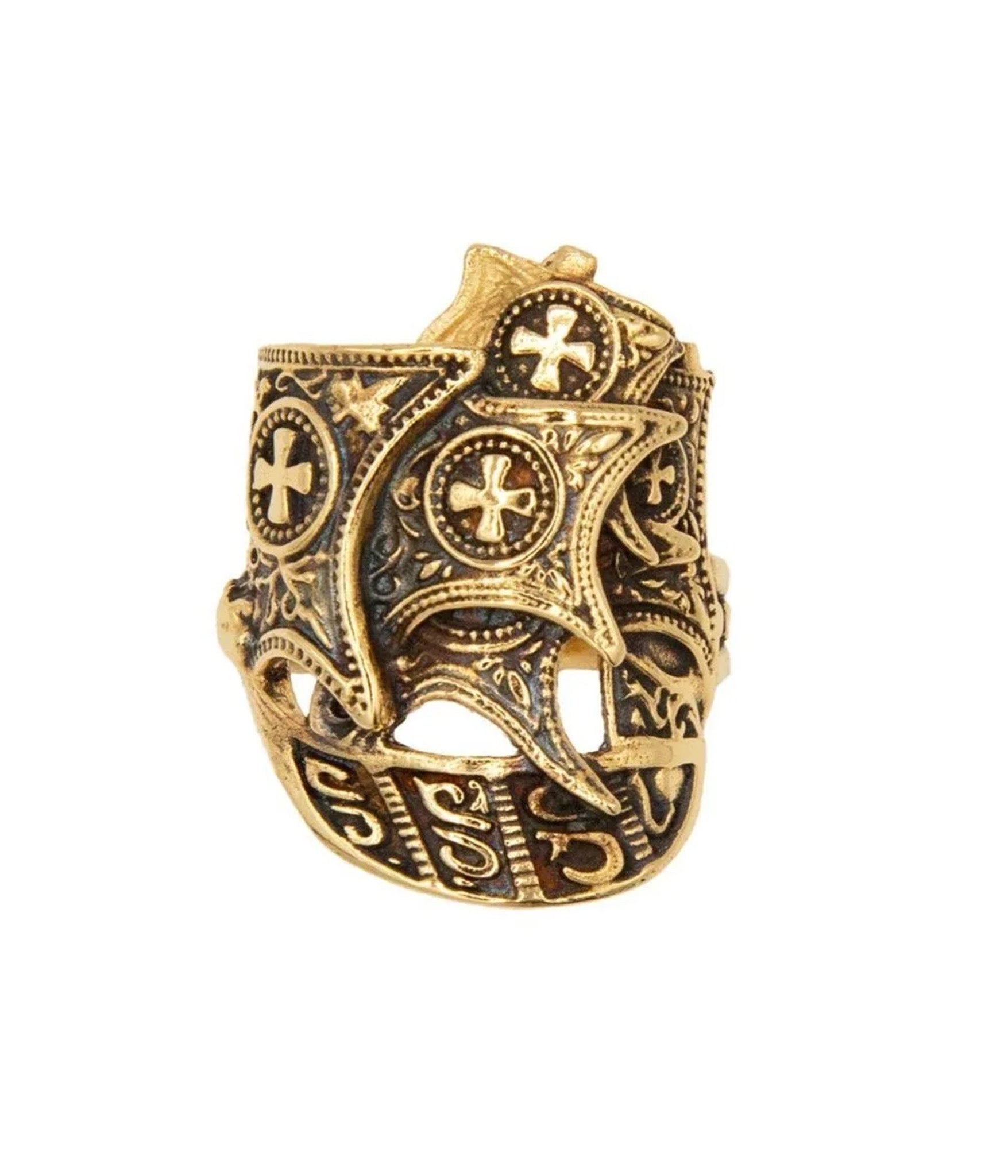 Gold ring with intricate designs on a white background