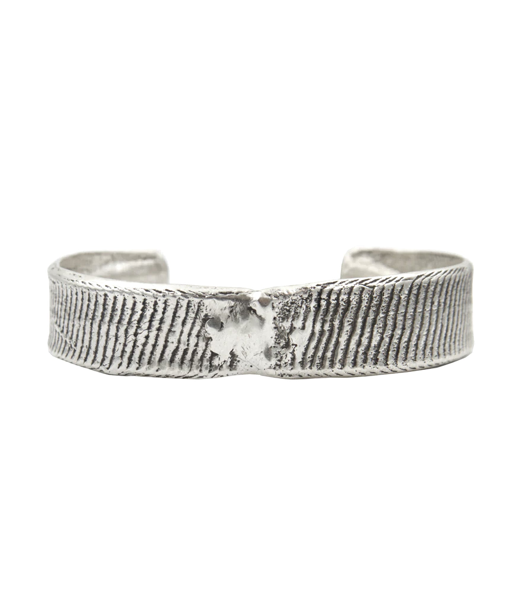 Silver textured ring on a white background