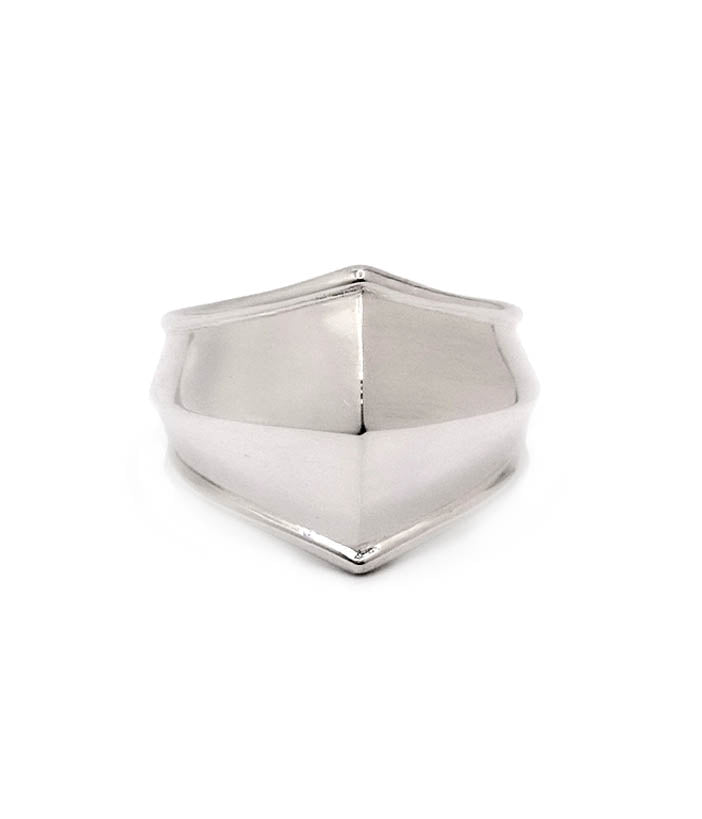 Silver ring with a shield design on a white background