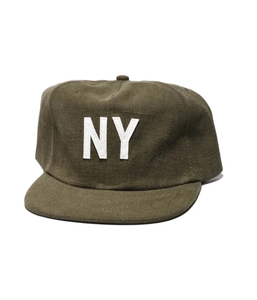 Green cap with 'NY' on a white background