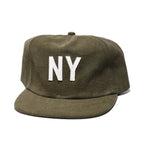 Green cap with 'NY' on a white background