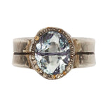 Silver ring with a large gemstone on a white background