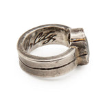 Silver ring with 'W. City' engraving on a white background