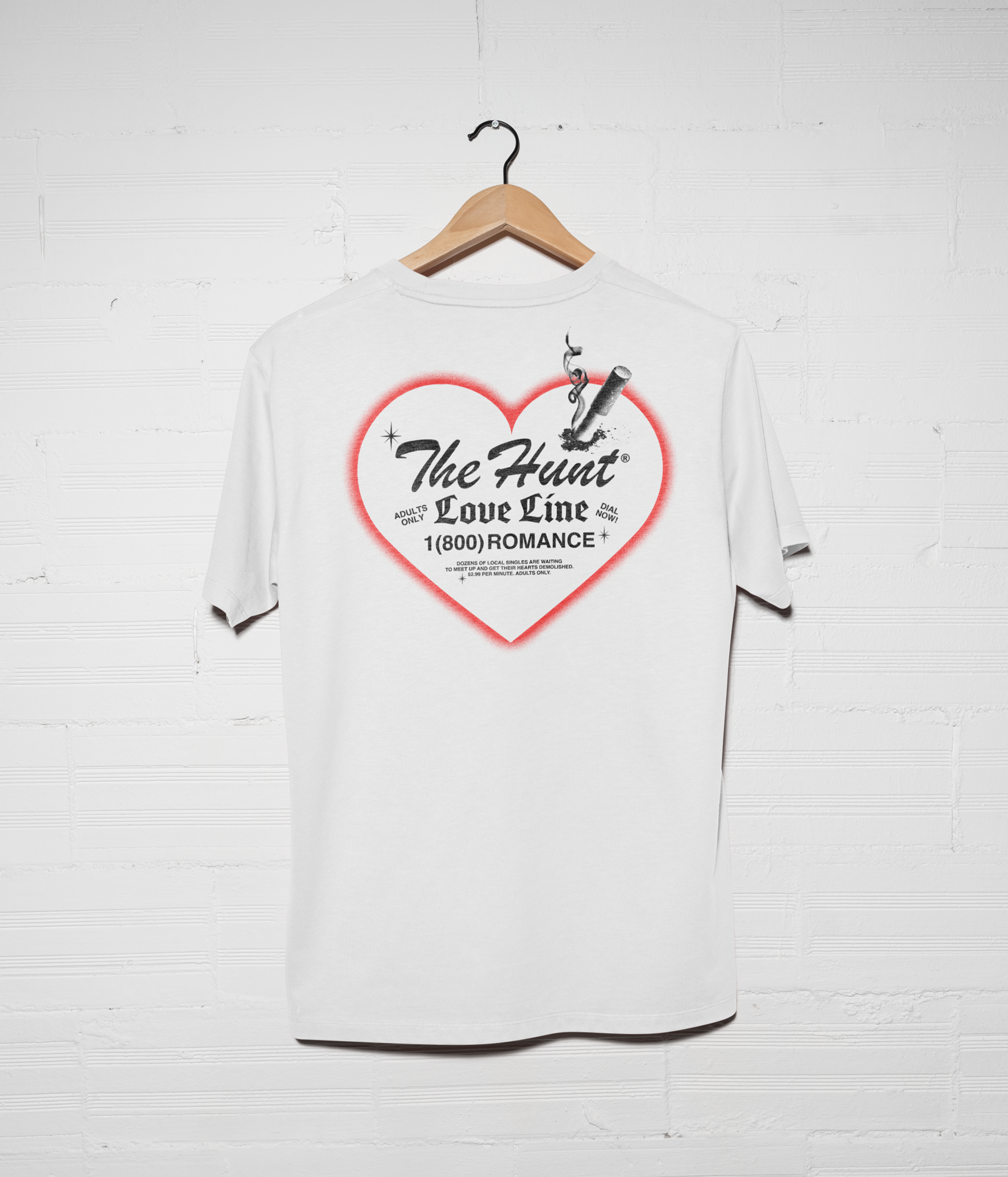 White t-shirt with a red heart graphic and text on a white background