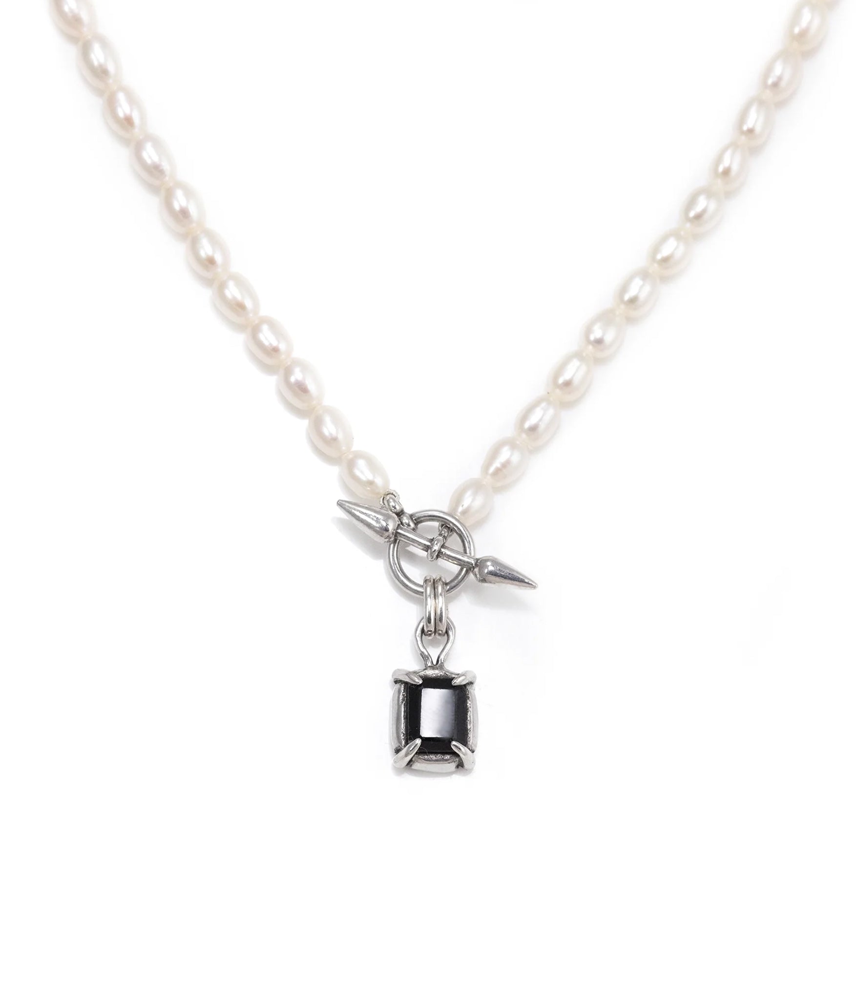 Freshwater pearl necklace with a square black onyx pendant and silver spike toggle closure