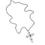 Silver chain necklace with a cross pendant on a white background