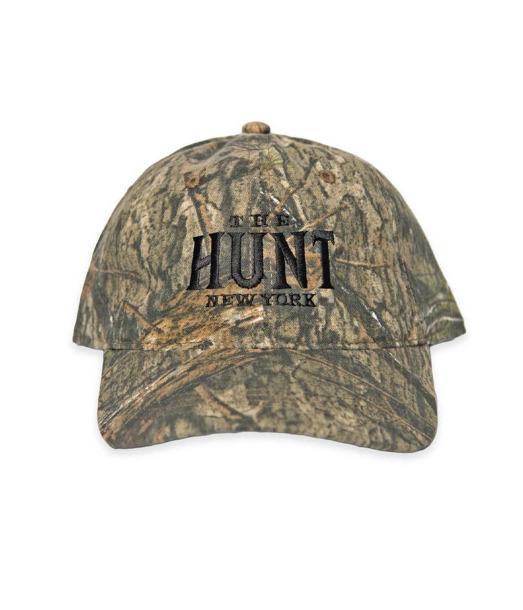 Camouflage baseball cap with 'New Hunt New York' text on a white background