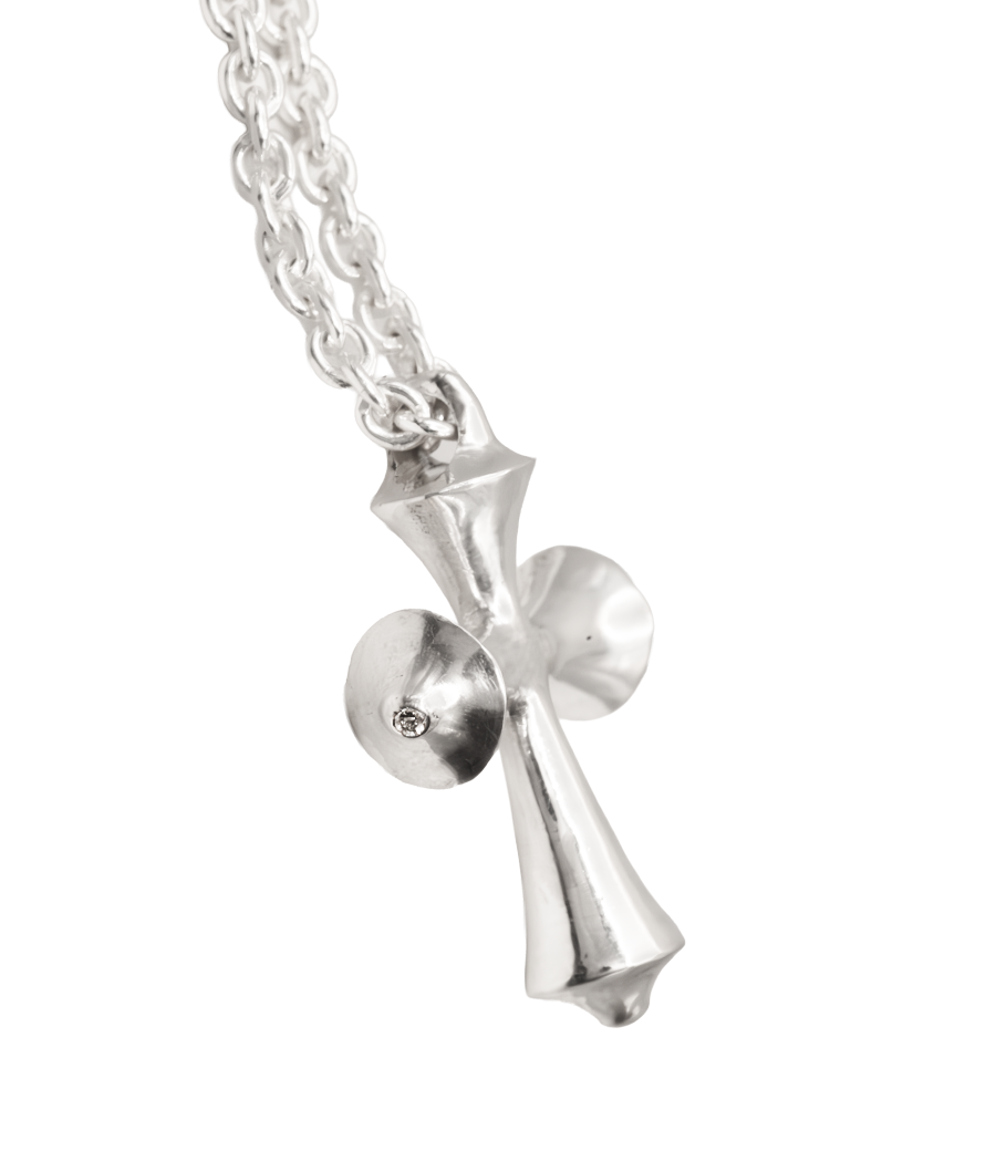 Silver cross pendant necklace on a white background