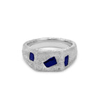 Silver ring with blue gemstones on a white background