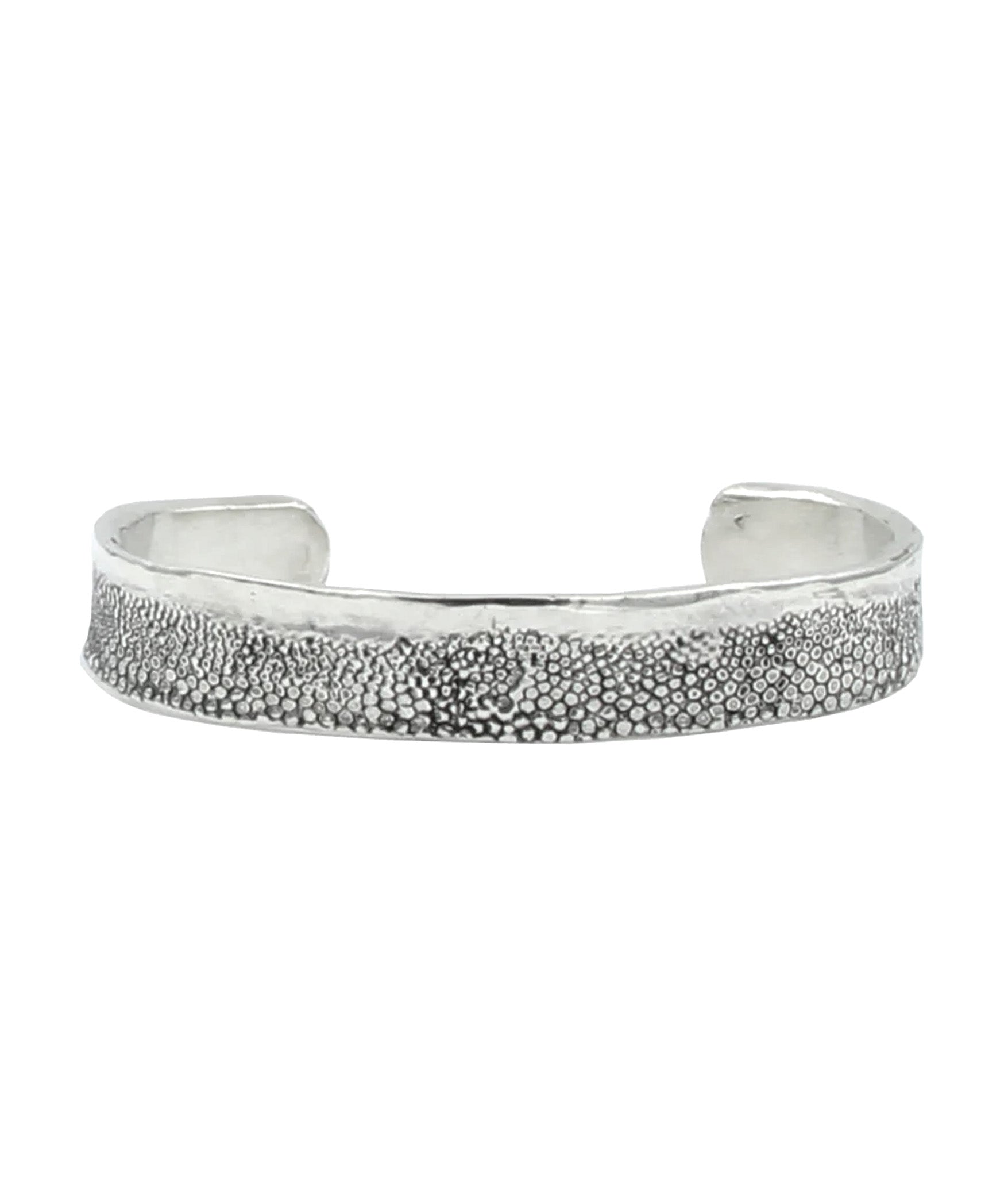 Silver textured bracelet on a white background
