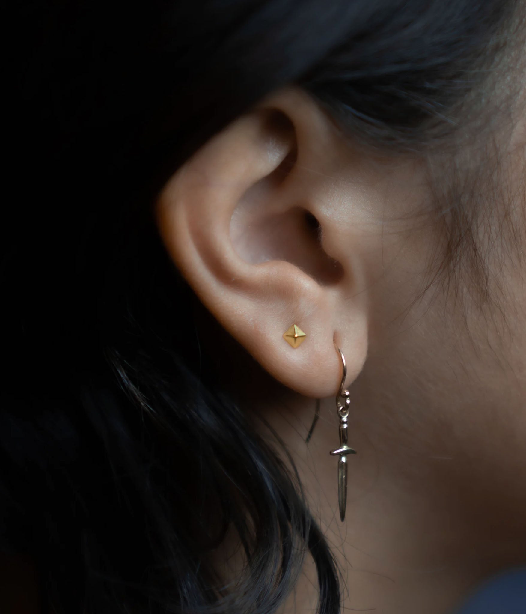 Yellow Gold Spike Earrings on model. 