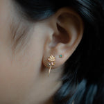 solid gold rose earring on model 