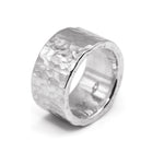 Silver ring with a textured surface on a white background