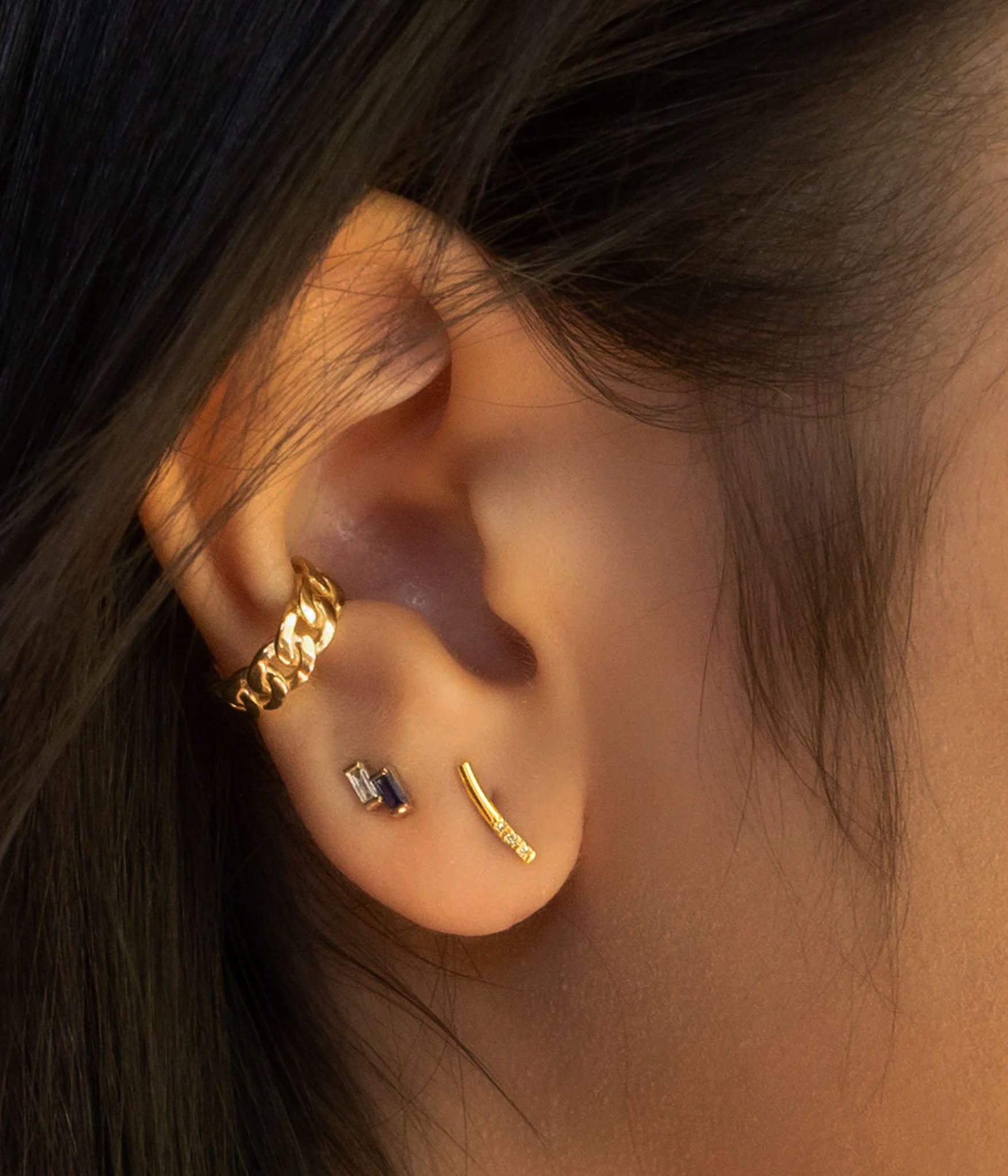 bar earring on ear