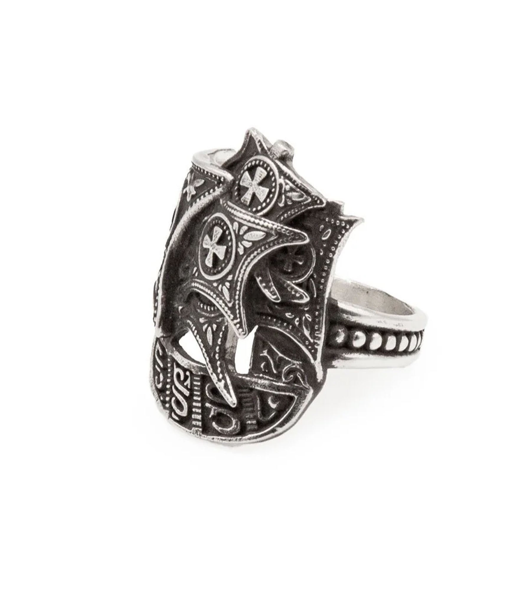 Silver ring with intricate designs on a white background