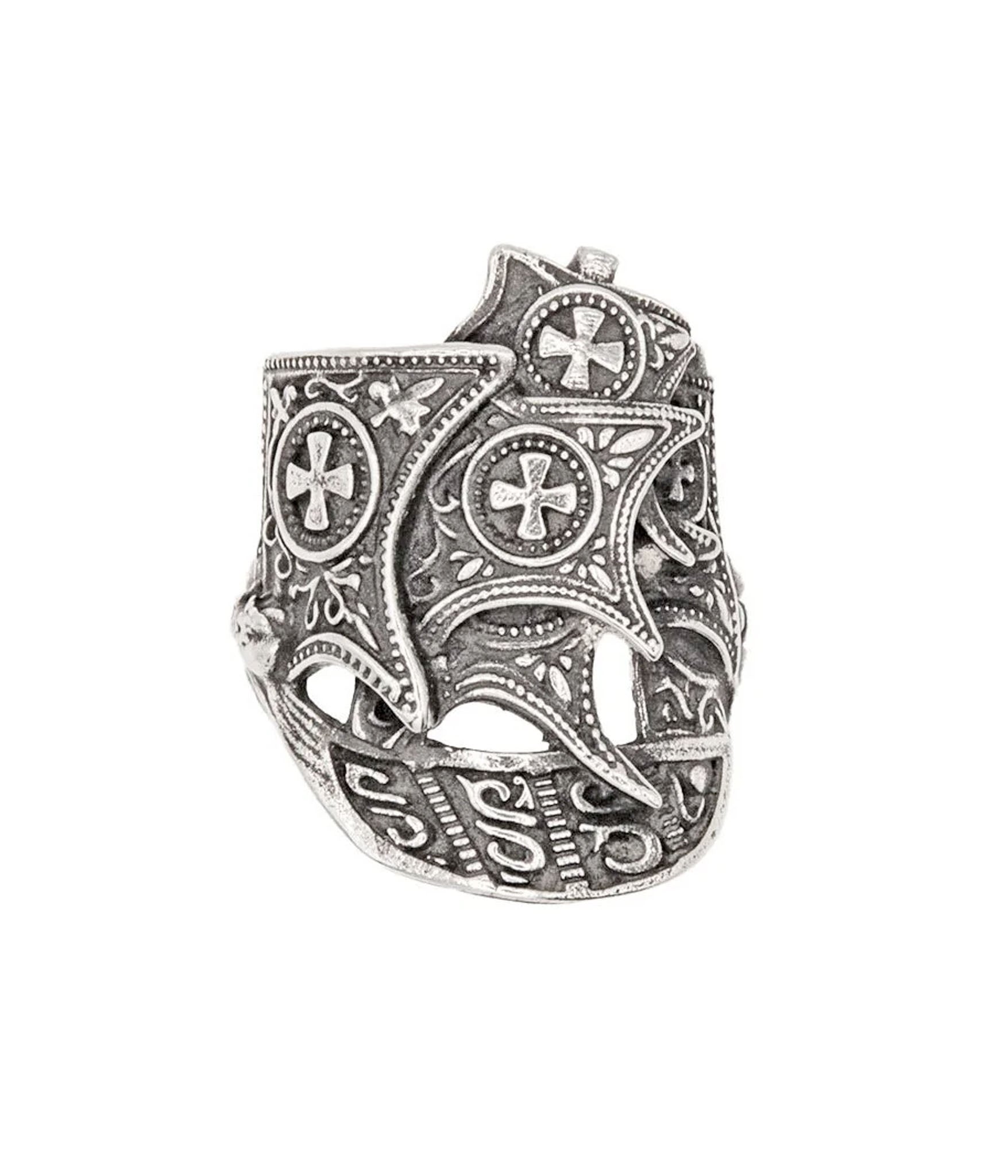 Silver ring with intricate designs on a white background