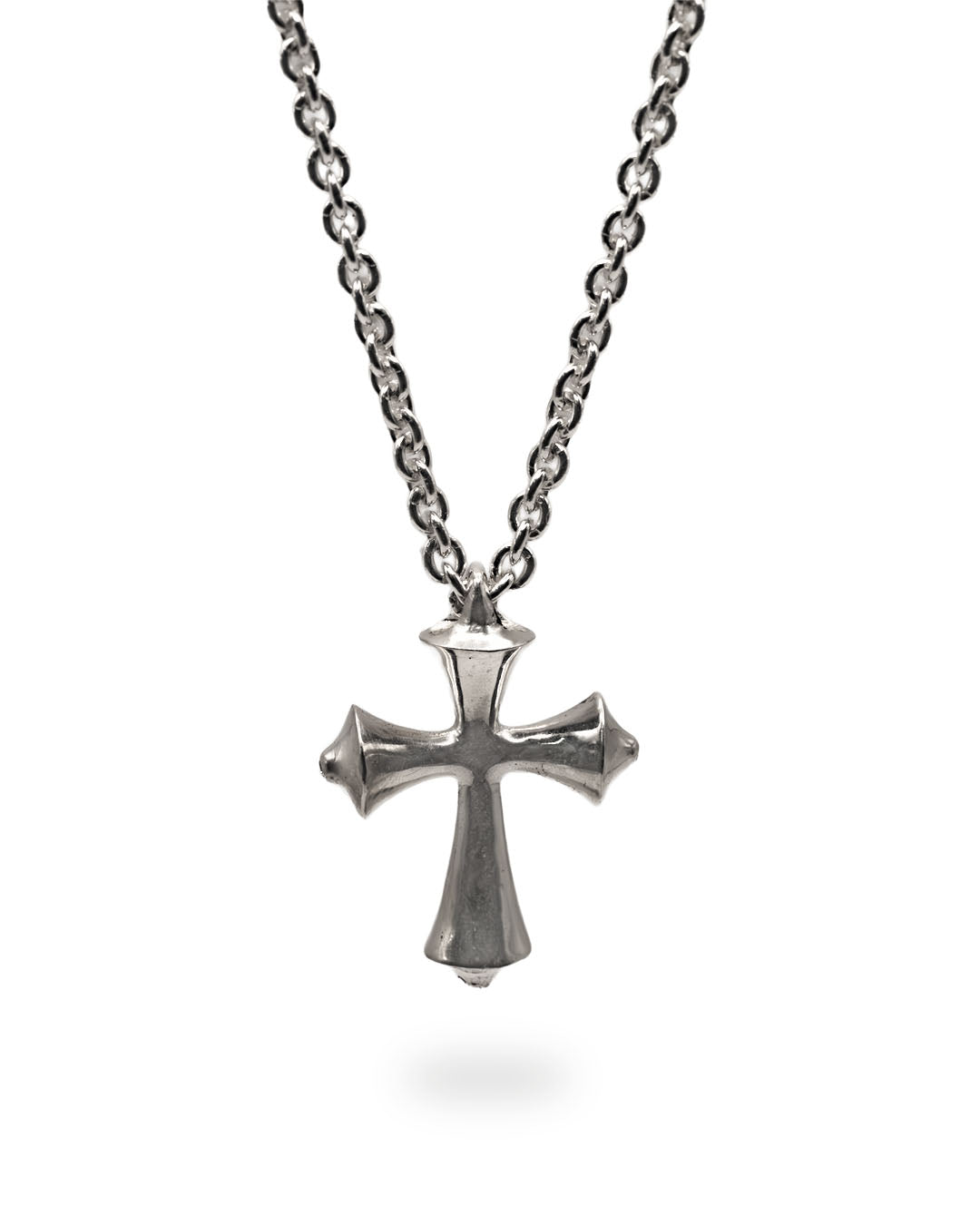 Silver cross necklace on a white background