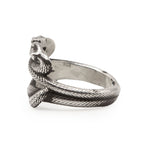 Silver snake-shaped ring on a white background