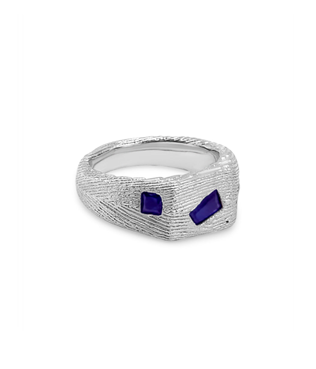Silver ring with blue stones on a white background