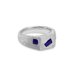Silver ring with blue stones on a white background