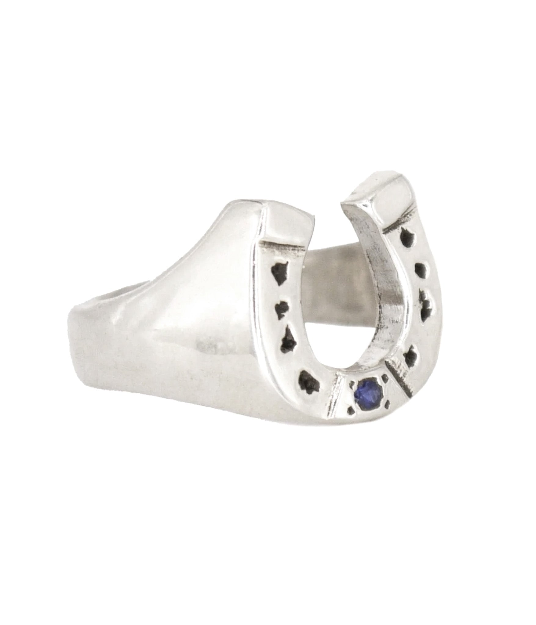 Silver horseshoe-shaped ring with a blue gemstone on a white background