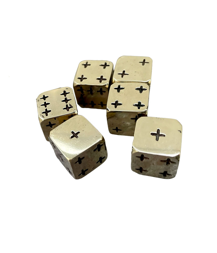 Set of brass dice with star patterns on a white background