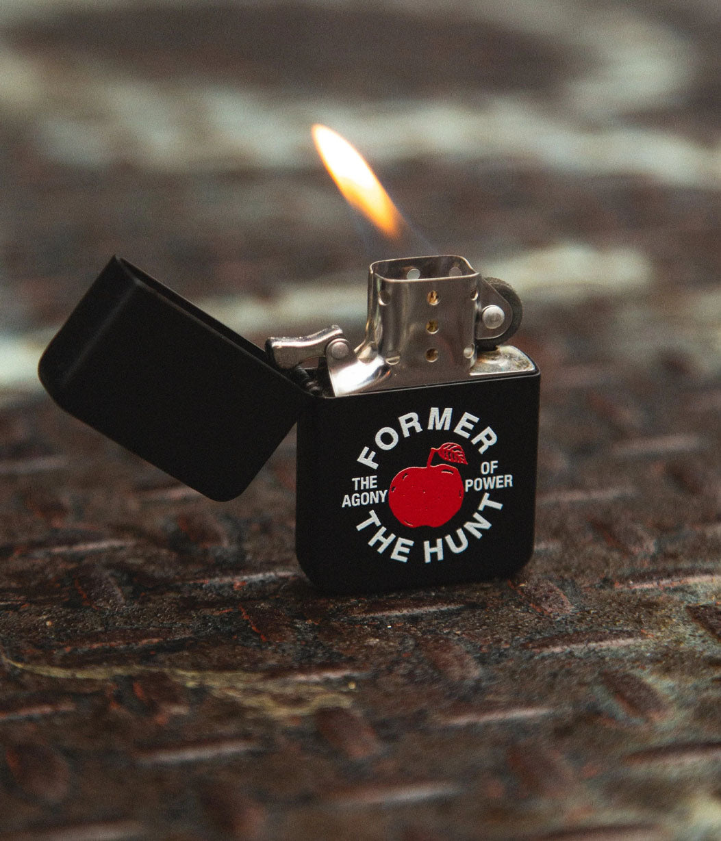 Lighter with a design and text on a textured surface