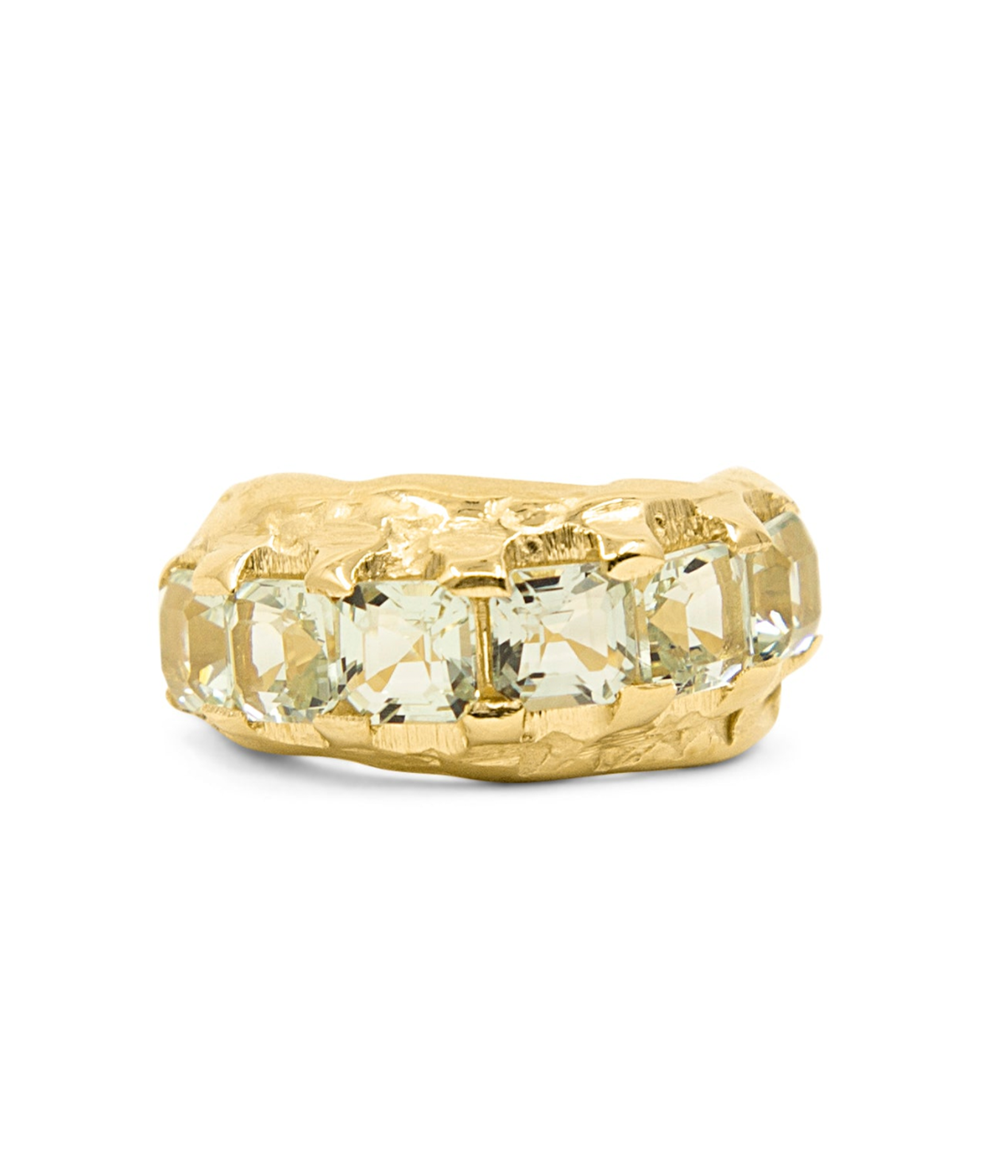 Gold ring with a large rectangular gemstone on a white background