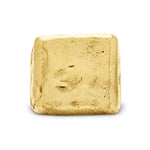 Gold-colored cube on a white background