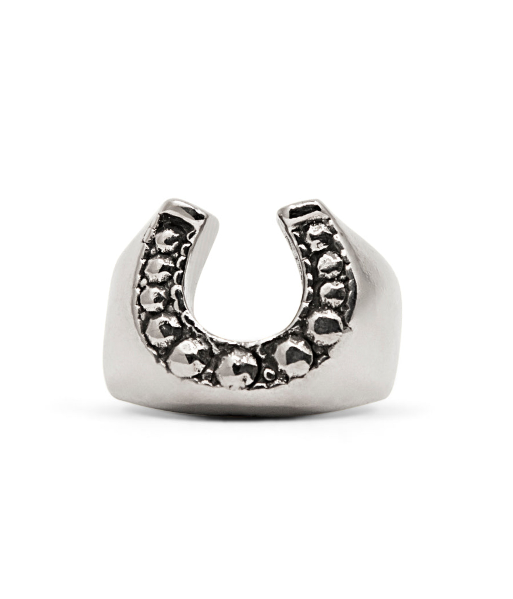 Silver horseshoe-shaped ring with embedded stones on a white background