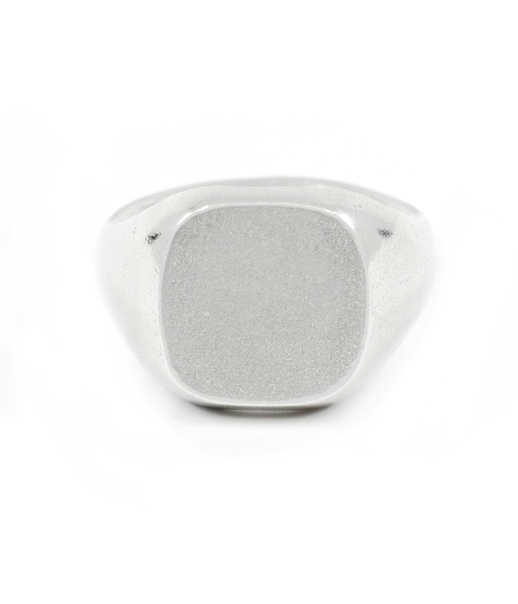 Silver ring with a textured surface on a white background
