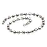 Silver beaded necklace on a white background