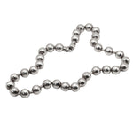 Silver beaded necklace on a white background