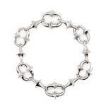 Silver bracelet with star-shaped links on a white background