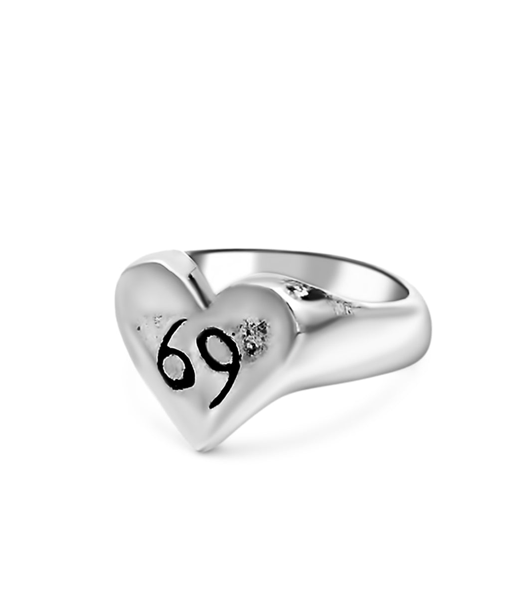 Silver heart-shaped ring with the number '69' on a white background