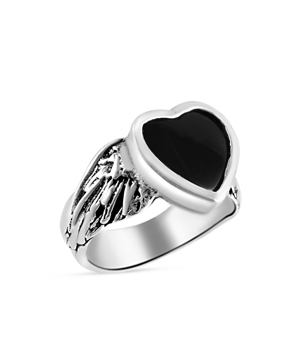 Silver ring with a black heart-shaped stone on a white background