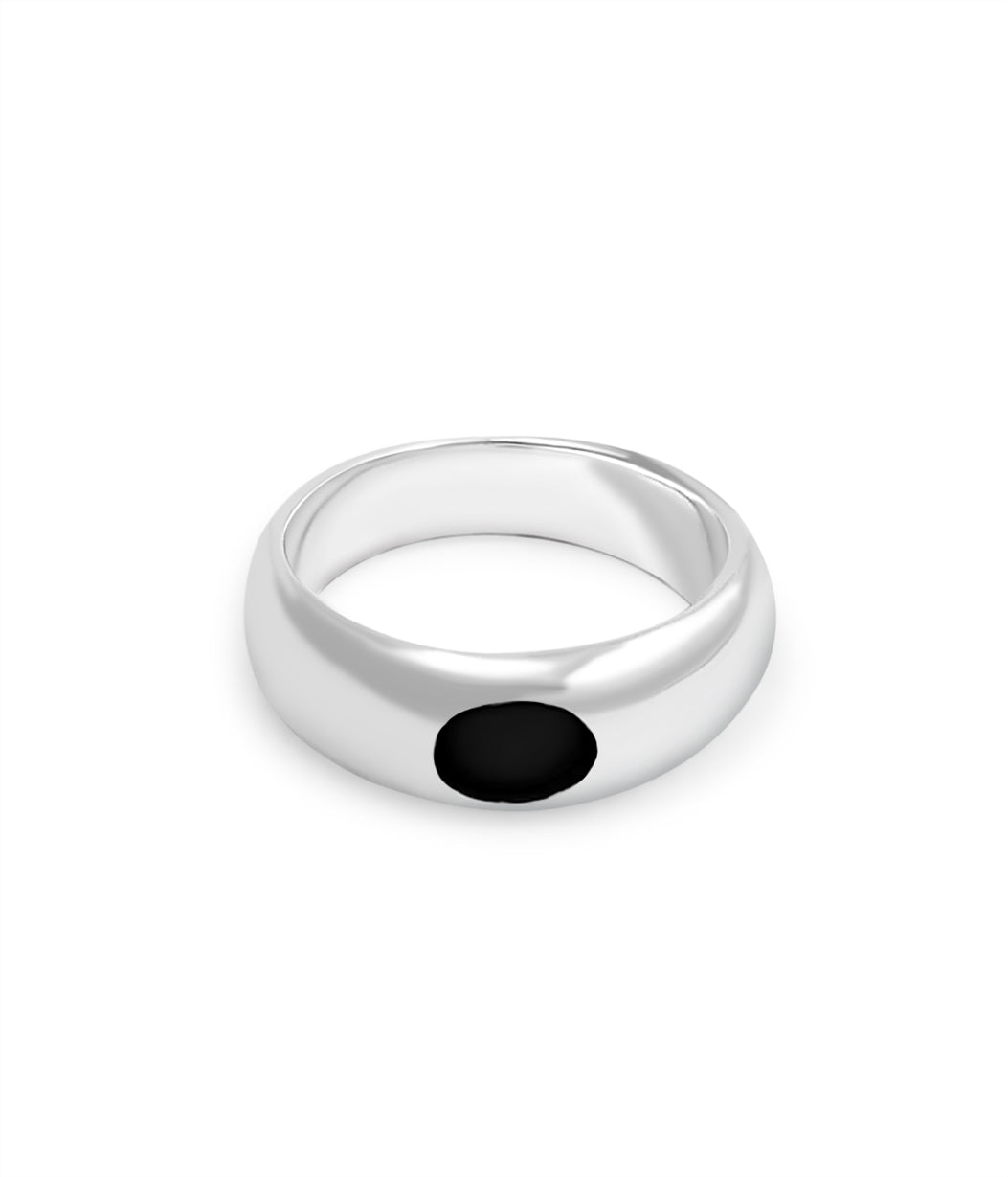 Silver ring with a black gemstone on a white background