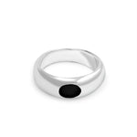 Silver ring with a black gemstone on a white background